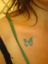 glitter butterfly tattoo on chest